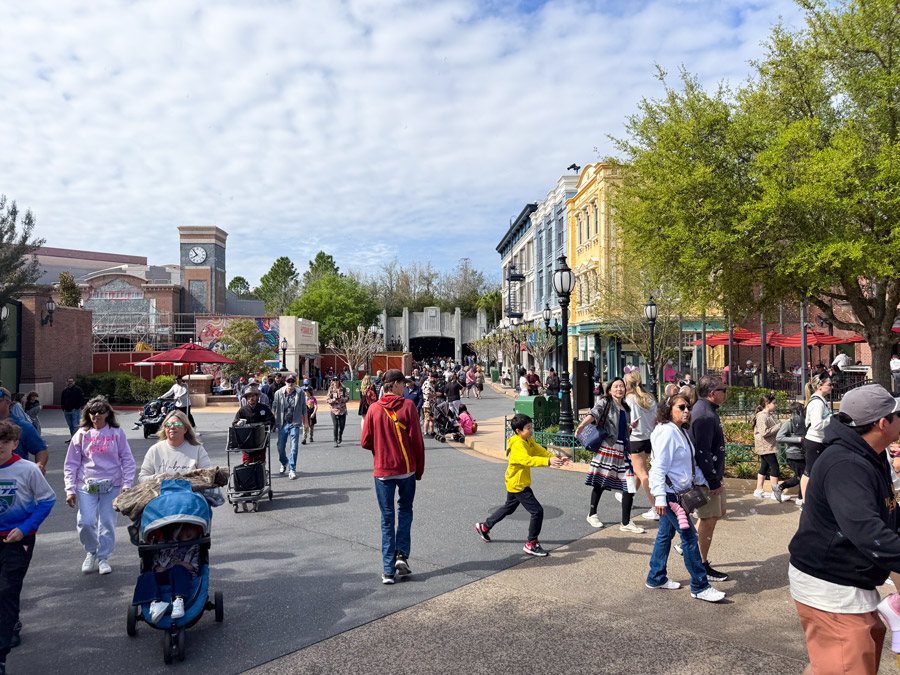 Busy walkway with crowds near Grand Avenue at Disney’s Hollywood Studios in Orlando.