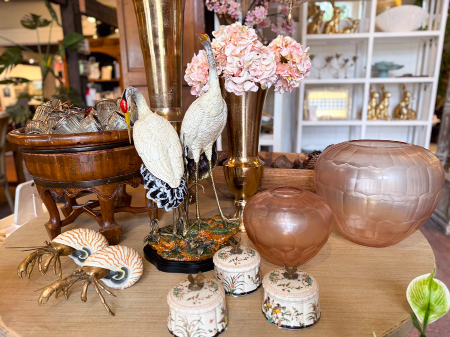 decor cranes and pink vases, art display at Roger's Gardens.