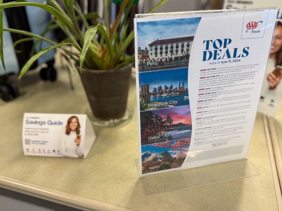AAA Travel Top Deals flyer with vacation offers for Peru, New York, Oahu, and Japan