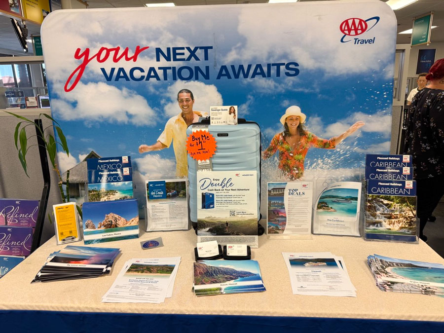 AAA Travel vacation deals display with Mexico, Caribbean, Hawaii, and cruise brochures