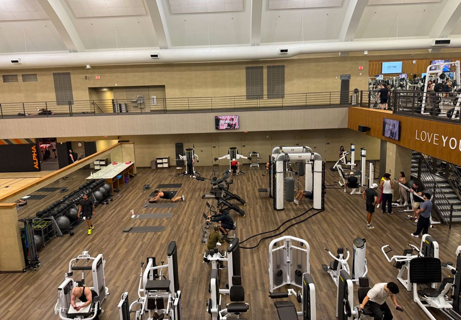 Spacious training floor with strength and functional fitness equipment at Life Time Fitness