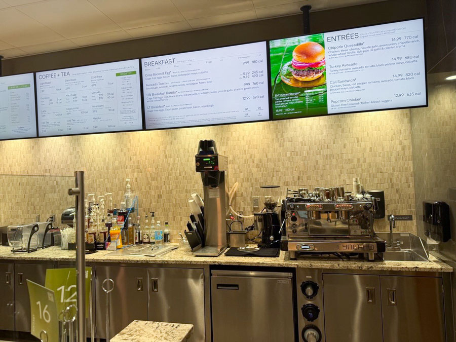 LifeCafe menu boards and coffee bar inside Life Time Fitness health club