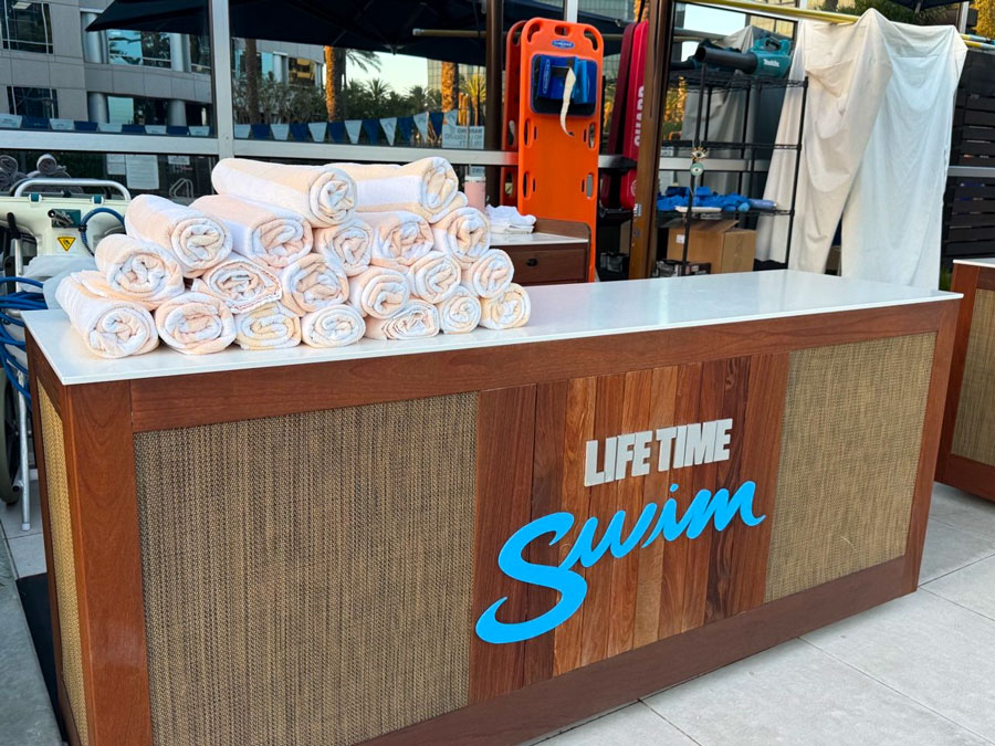 Towel station at the Life Time Swim outdoor pool area