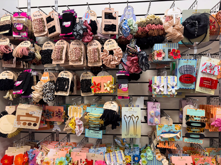 Hair clips, scrunchies, and beauty accessories displayed in the TJ Maxx gift section.