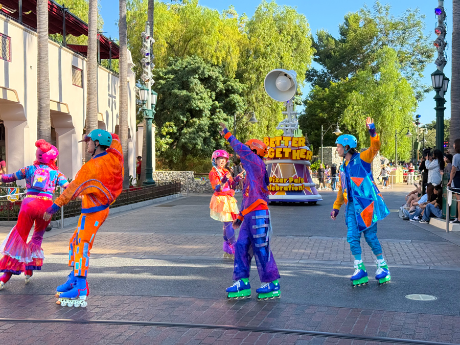 Colorful roller-skating performers during Pixar Pals Celebration at Disney California Adventure