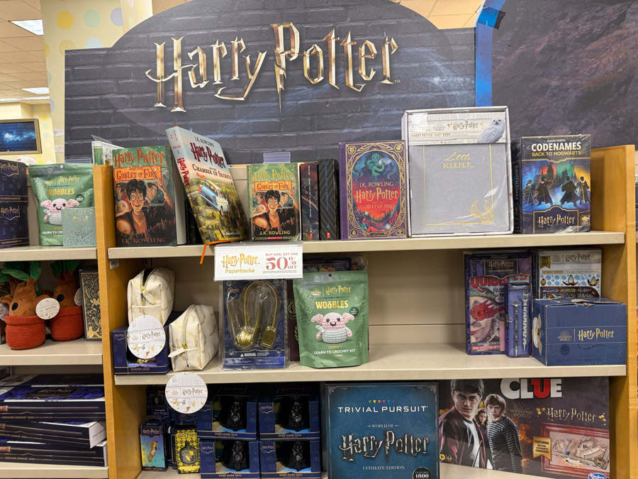 Large Harry Potter collection with books, games, and merchandise