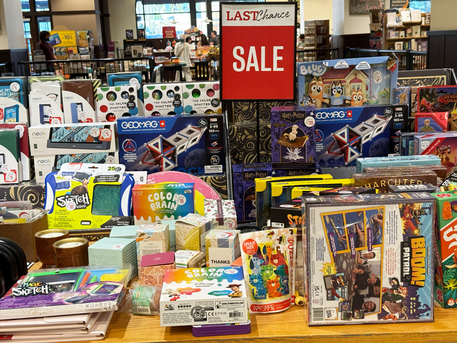 Last Chance Sale table with toys, games, puzzles, and gifts
