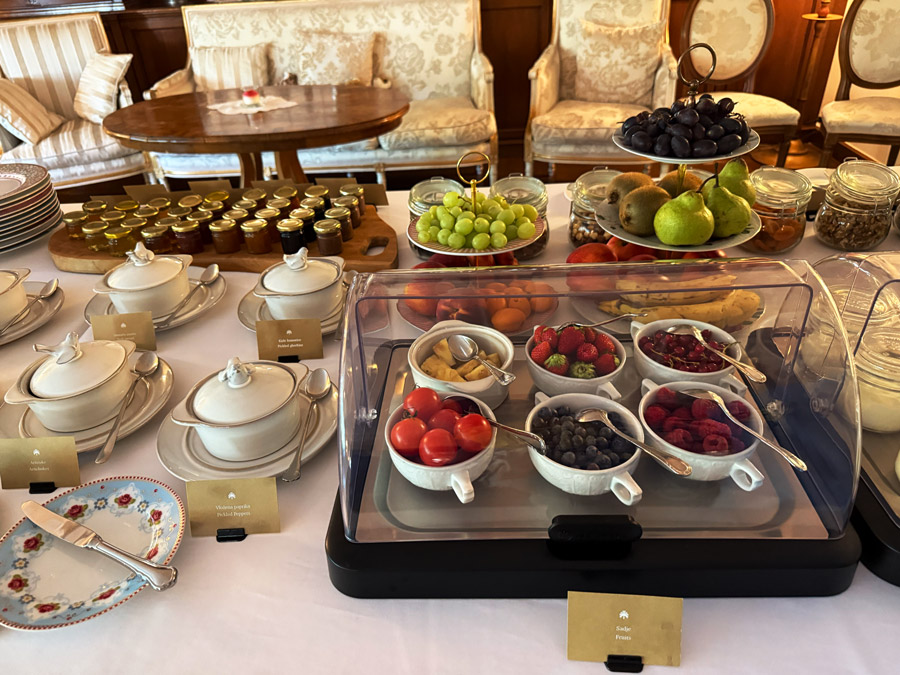 Kendov Dvorec breakfast buffet with fresh fruit, berries, homemade jams, and cereals