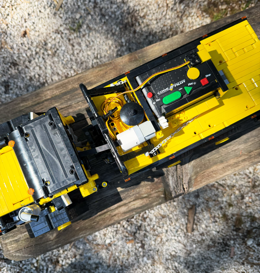 Yellow remote-controlled brick-built vehicle at BuWizz Camp 2026