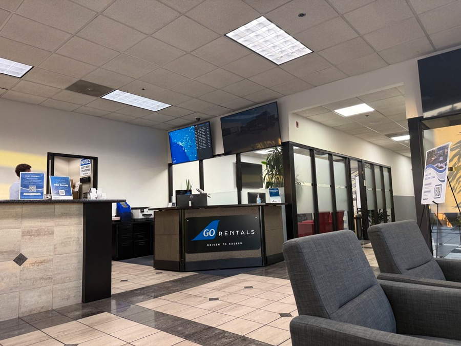 ACI Jet South lobby with a GO Rentals counter and lounge seating