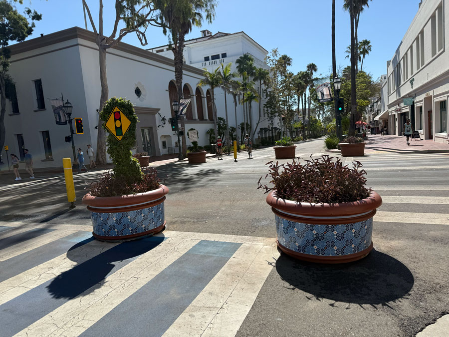State Street intersection with palm trees and tiled planters in downtown Santa Barbara