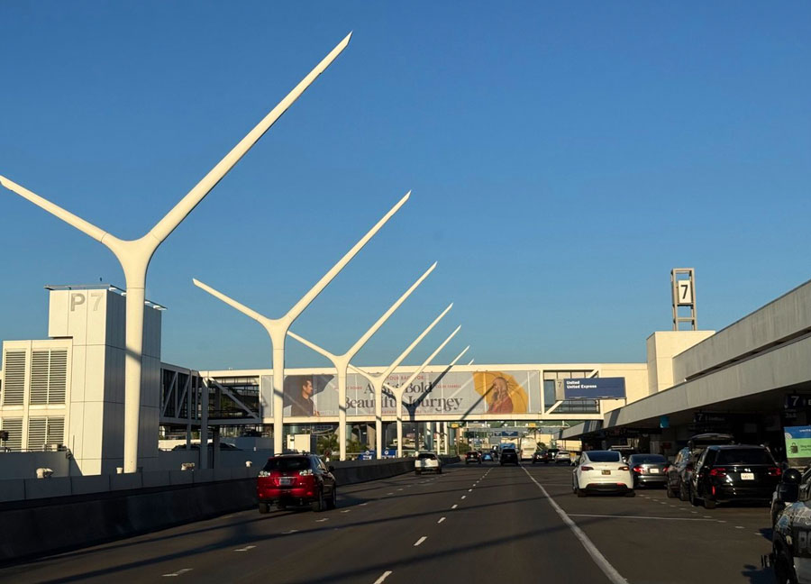 Cars outside LAX Terminal 7 beneath a United and United Express sign.