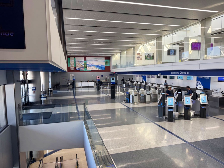United self-service kiosks and Economy Check-In counters at LAX.